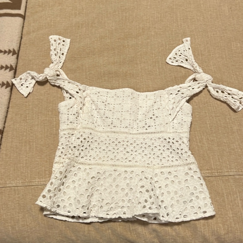 Never worn beautiful white off the shoulder eyelet tank top.